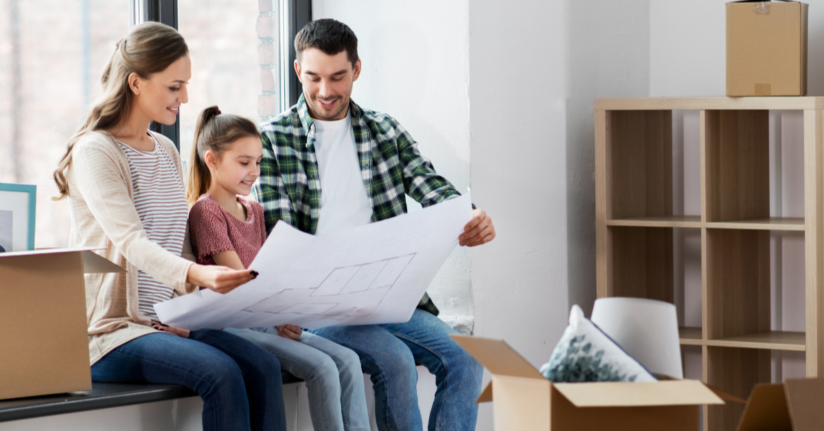 Family looking at house plan