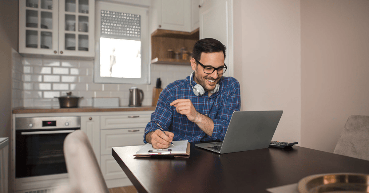 Man working from home kitchen background