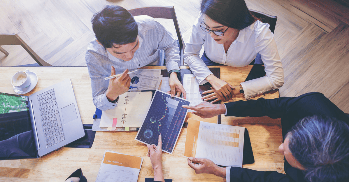 employees working at a desk together