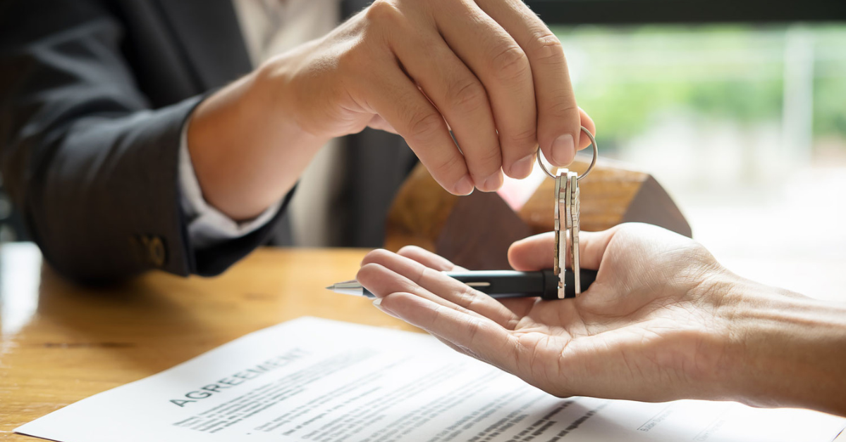 real estate agent with handing the keys