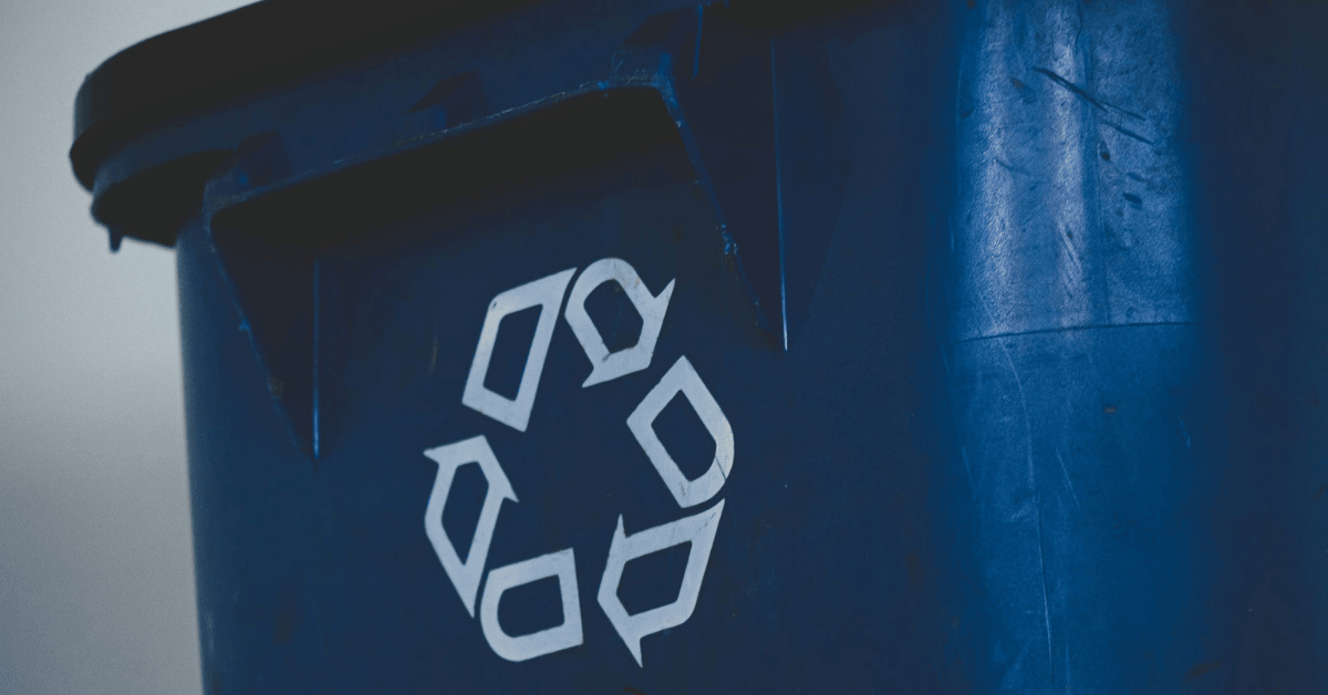 close up shot of a blue recycling bin