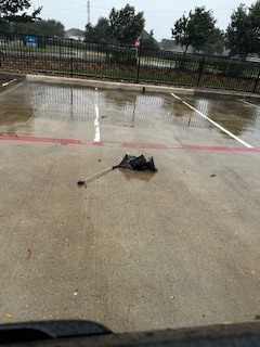 An abandoned umbrell that broke from torrential rain in Houston