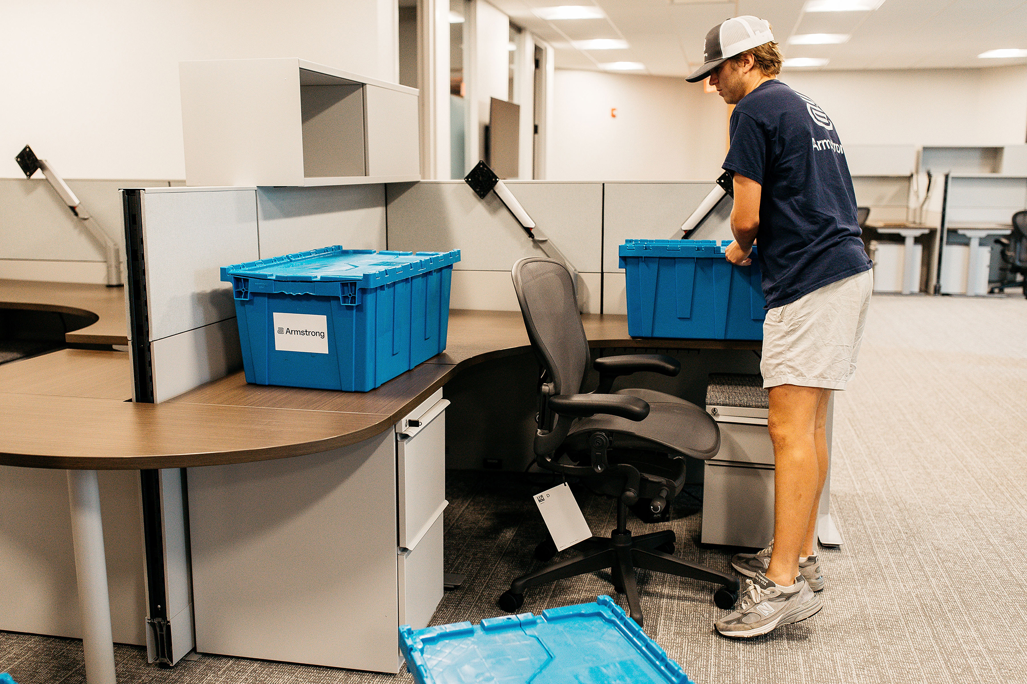 Professional movers pack up an office