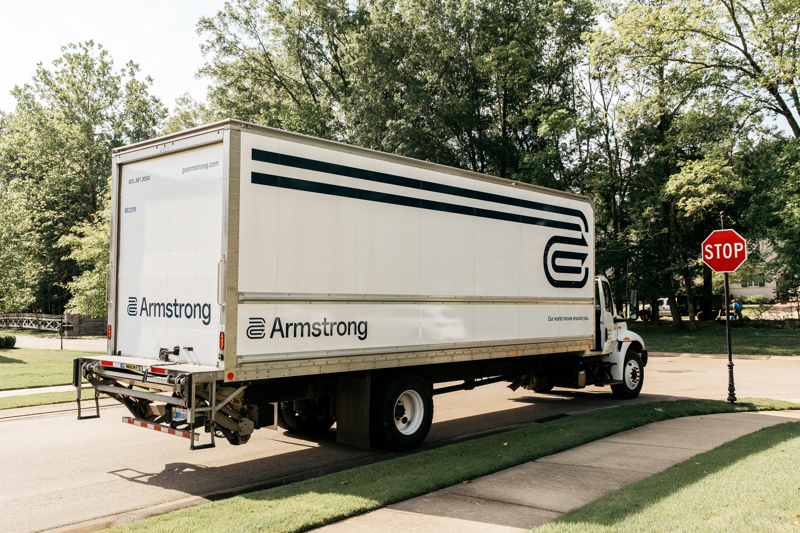 Armstrong moving truck parked outside a house