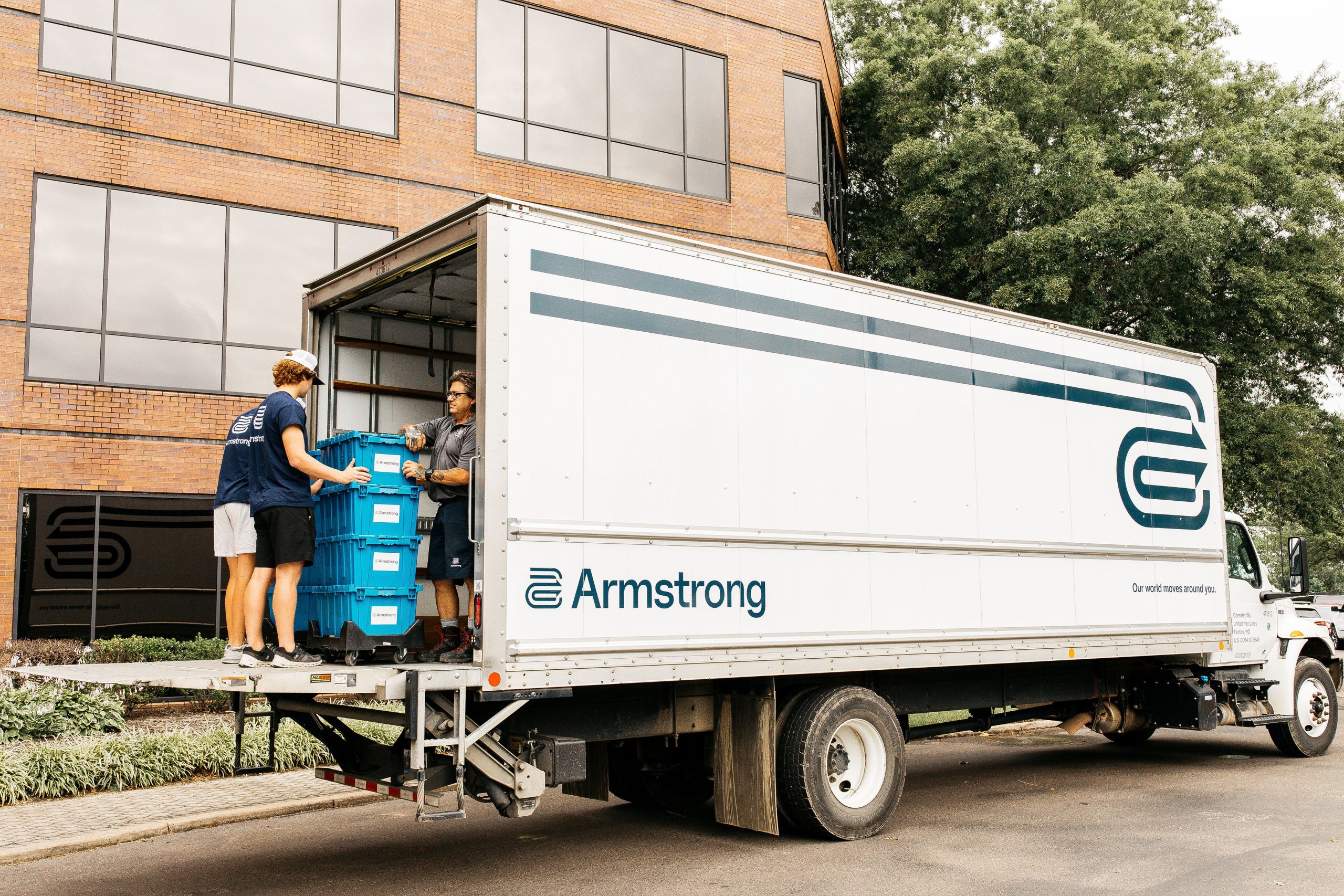 man taking boxes out of a moving truck