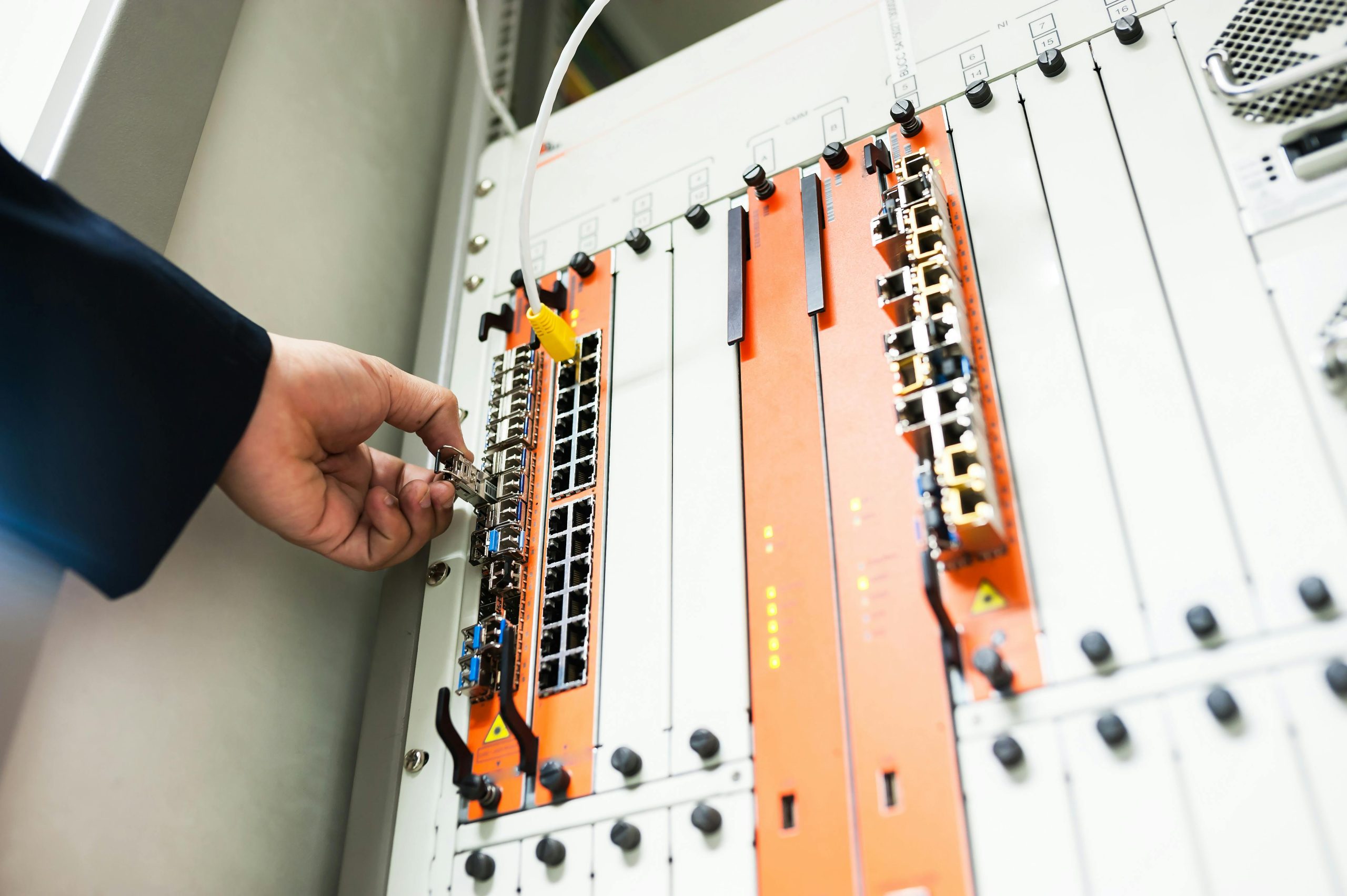 close up of a hand installing a server component