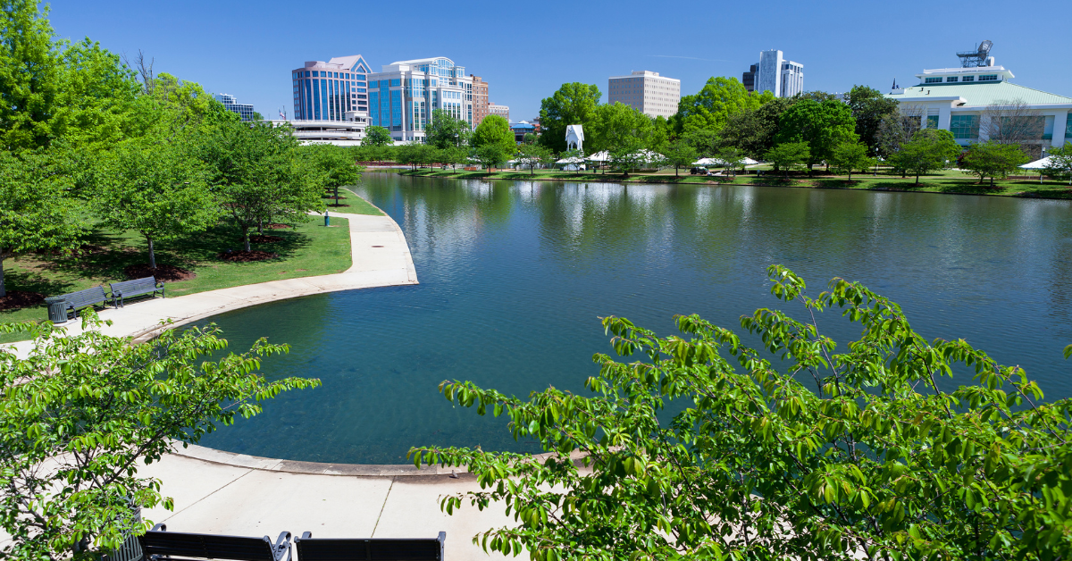 View of a lake with Huntsville Research Park in the background